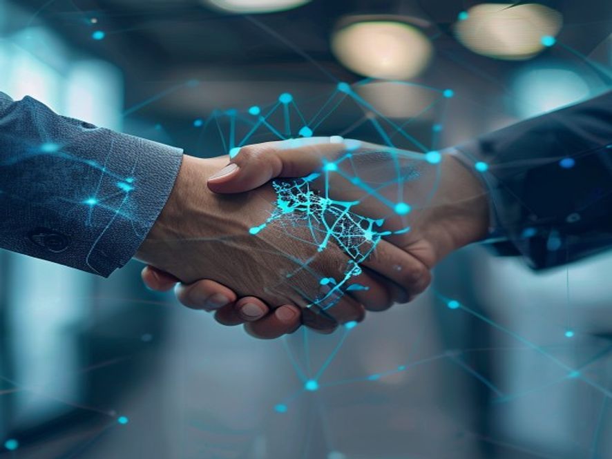 A professional handshake between two people in a modern office, with a subtle digital overlay of a network map in the background. The image conveys partnership, trust, and collaboration. High contrast, blue-toned professional photography style.